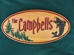 Cottage sign with trees and fish